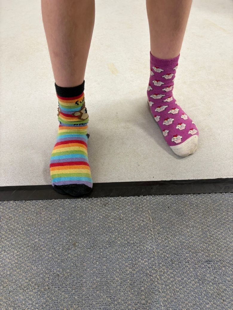 child wearing odd socks