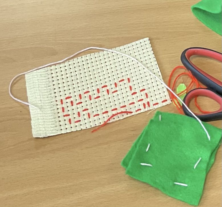 Running stitch example on binca and felt